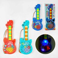 Гітара на батарейках TK - 14702 "TK Group", 3 кольори, ОЗВУЧУВАННЯ УКРАЇНСЬКОЮ МОВОЮ, 2 режими гри, 8 пісень, піаніно, прозорий корпус, рухомі ше